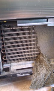 Condenser clogged with dirt and dust