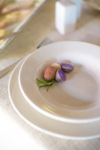White dinnerware on tablecloth