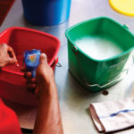Washing equipment in colored pails