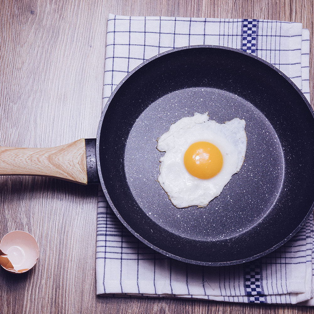 Egg frying in nonstick frying pan