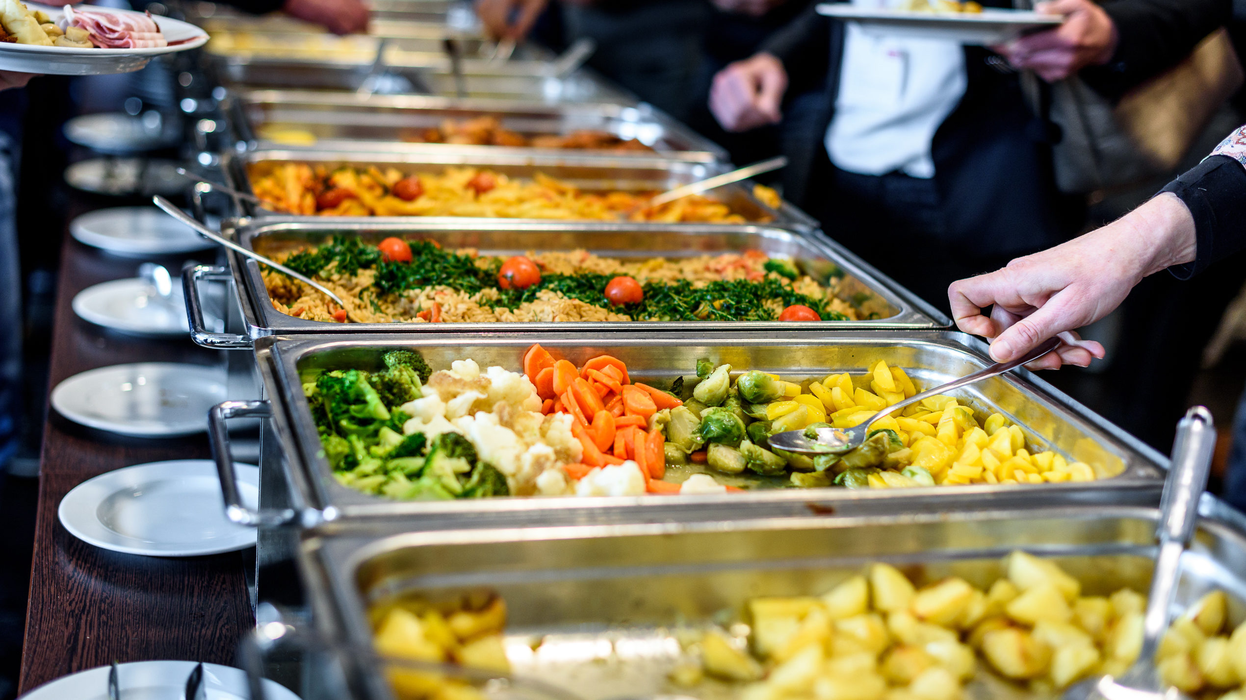 Group of people in catered buffet line