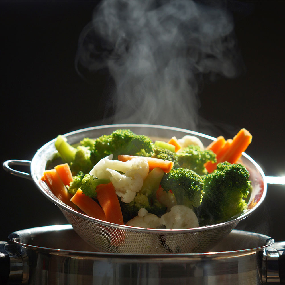 A healthy bowl of steaming hot vegetables. 
